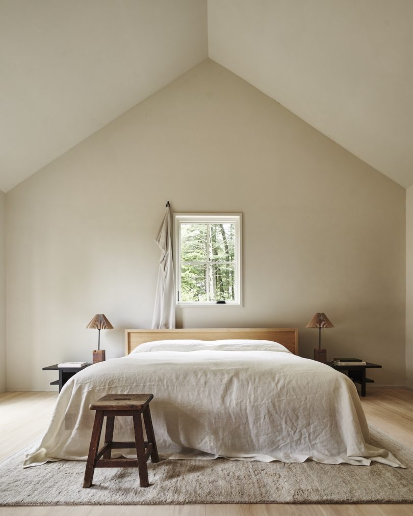 Interior of a cabin at INNESS, highlighting custom furniture, stocked kitchenette, and ample socializing space