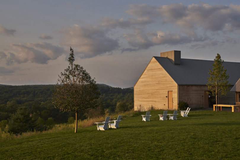 Exterior of the INNESS farmhouse, featuring Colonial Dutch architecture and a rustic charm