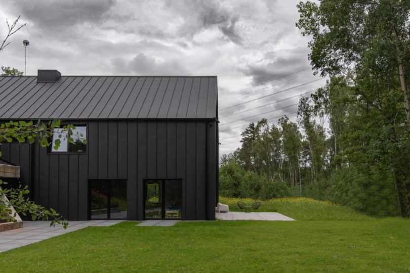 side exterior view of modern black house