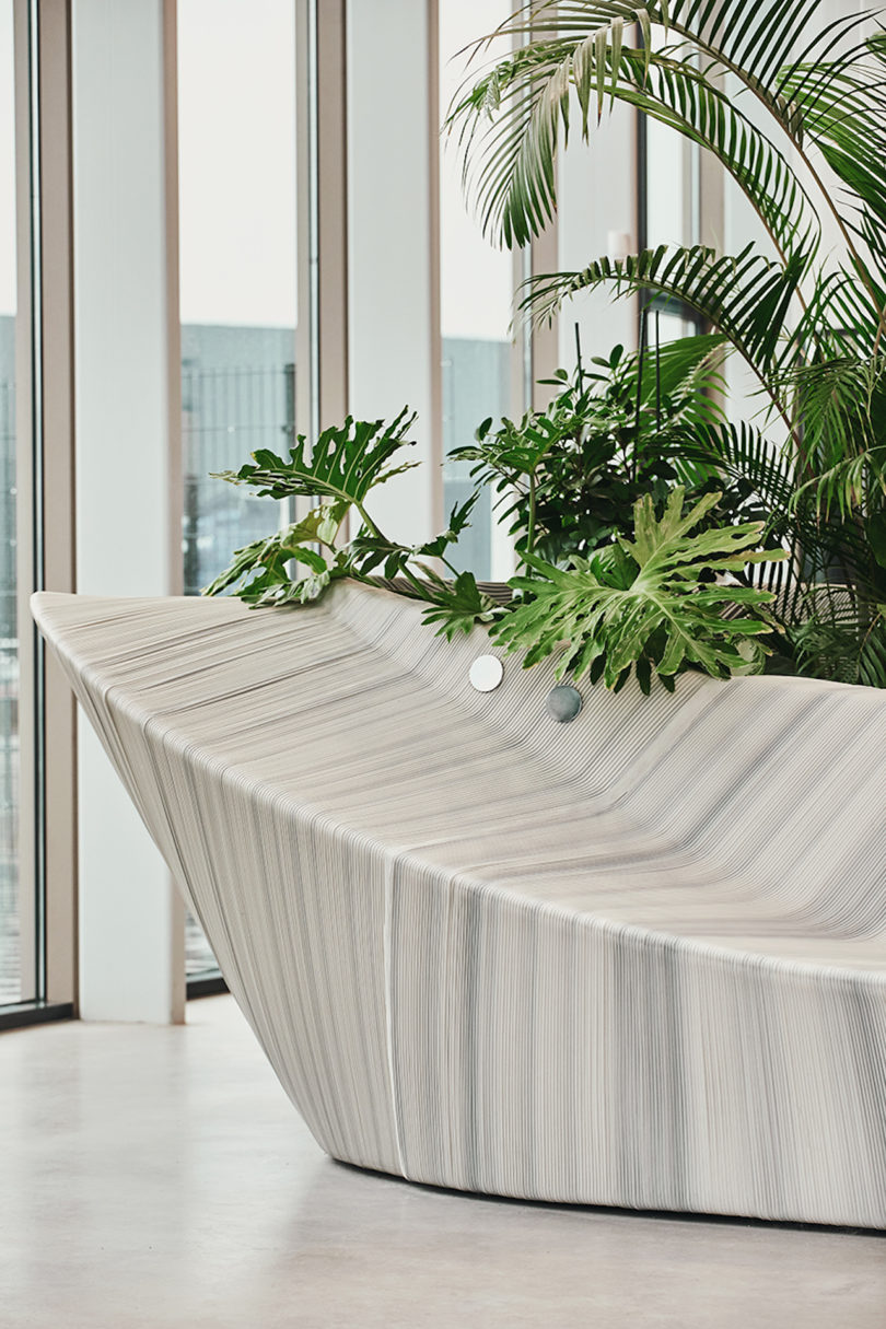 details of sculptural, white and grey furniture in office lobby