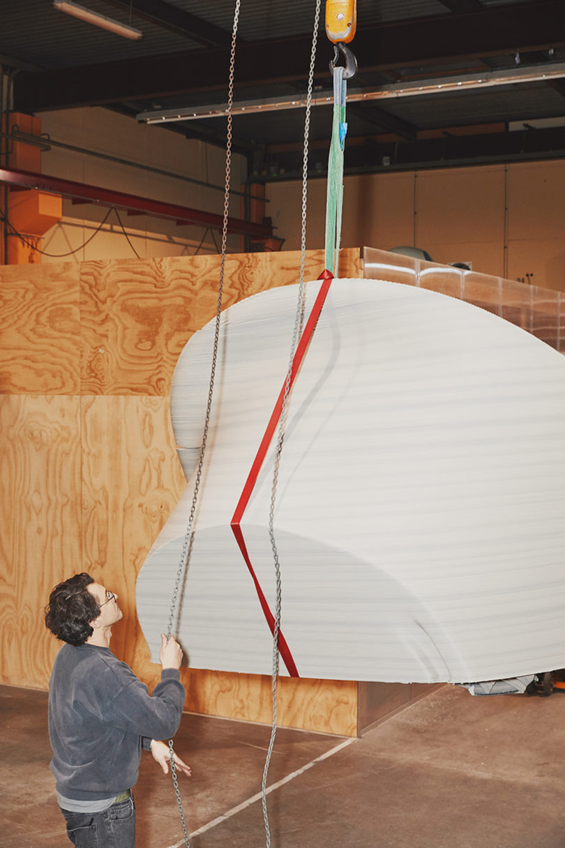 designer standing next to 3d printed furniture