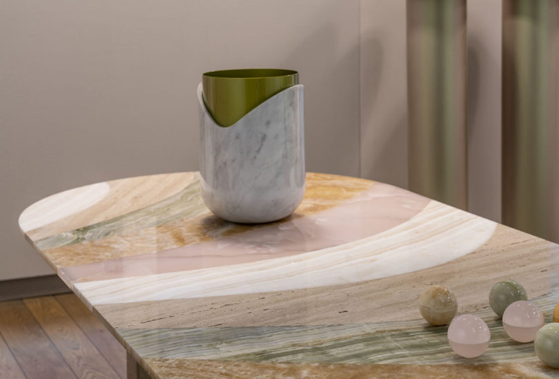 table with marbled pattern and a vessel sitting on top