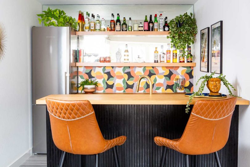 interior view of renovated wet bar in basement with colorful tile