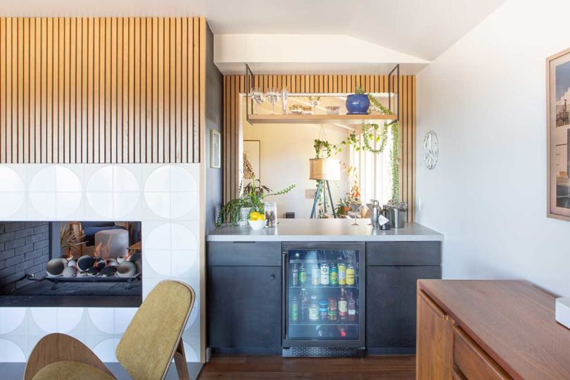 corner dry bar in modern living room with shelves