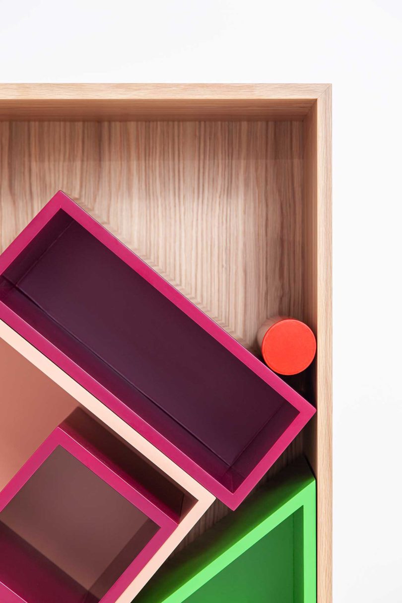 modular storage shelf with colorful geometric boxes inside