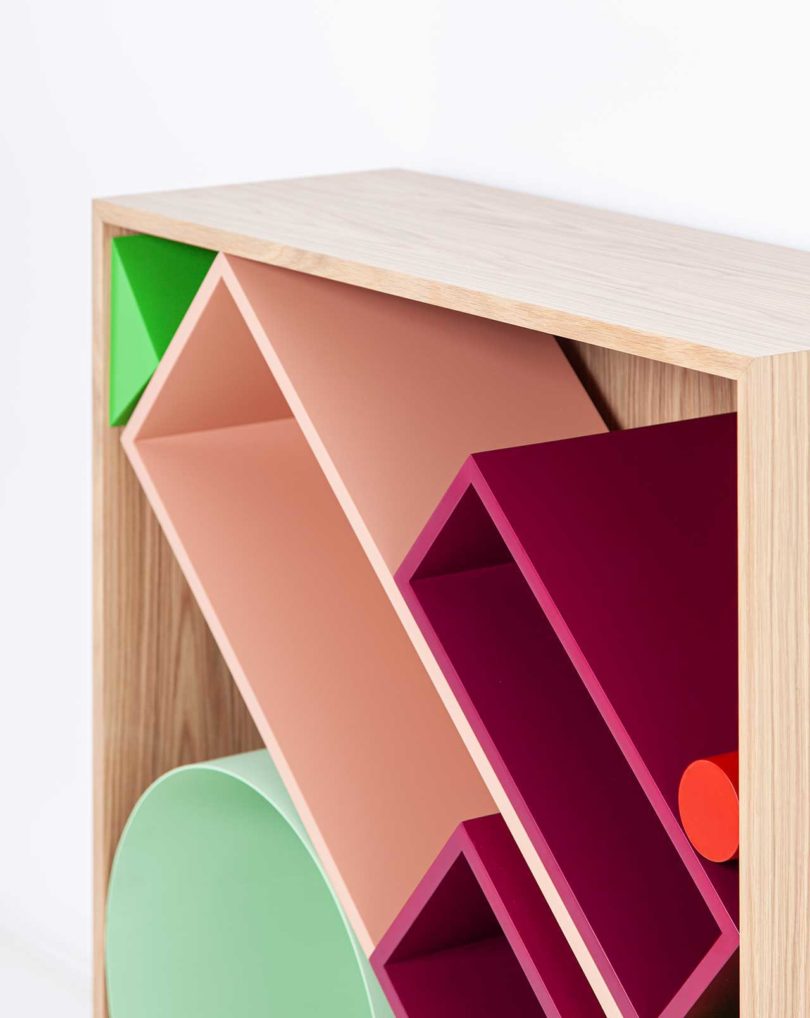 modular storage shelf with colorful geometric boxes inside