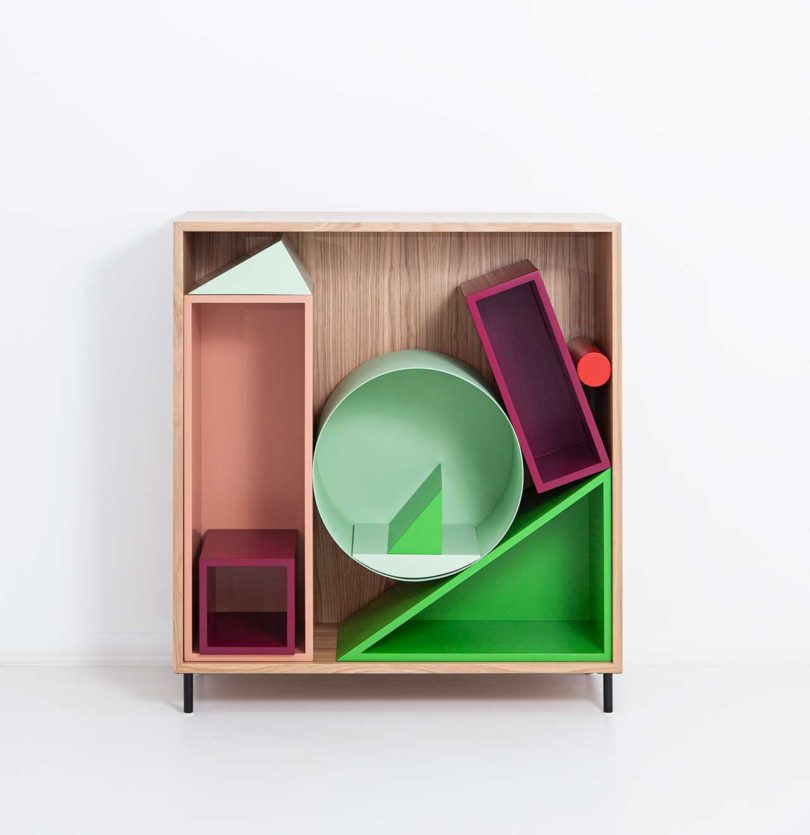 modular storage shelf with colorful geometric boxes inside