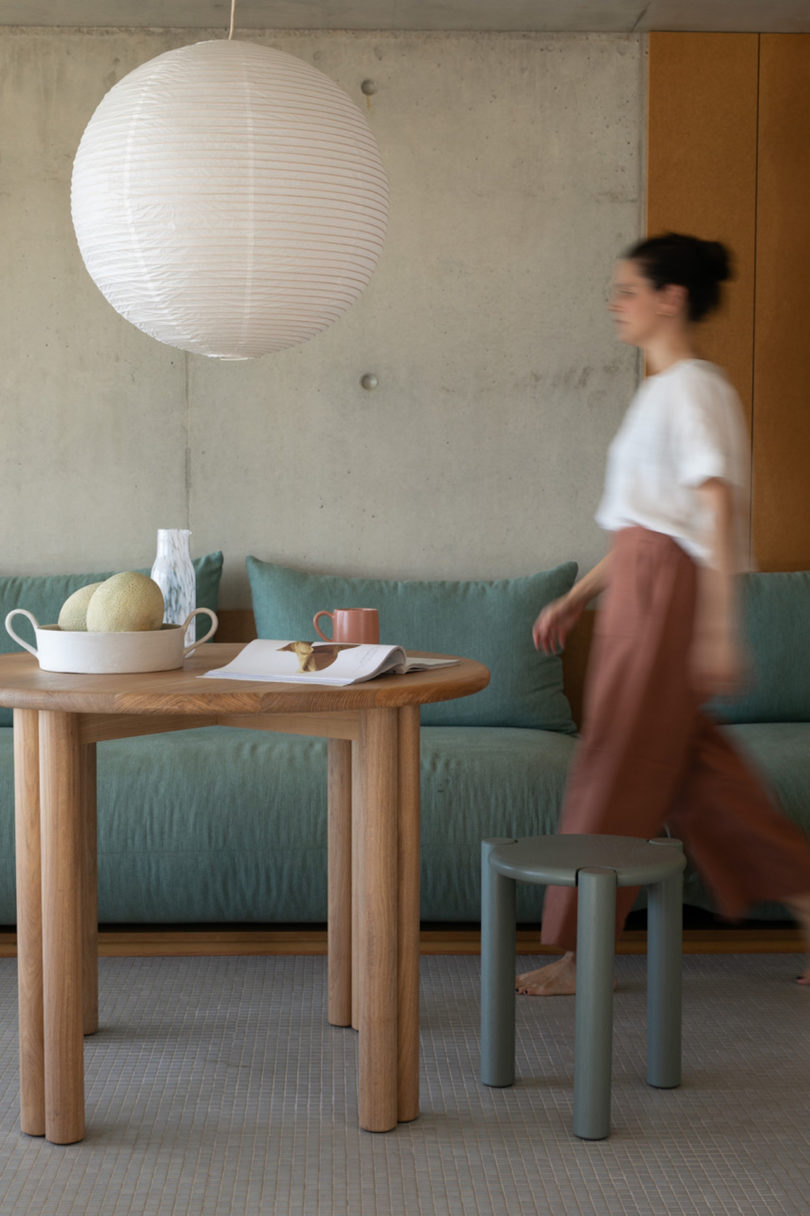 woman walking to dining table