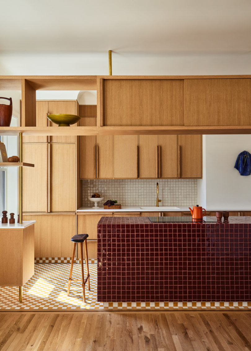 Sculptural island with all-electric appliances in the kitchen