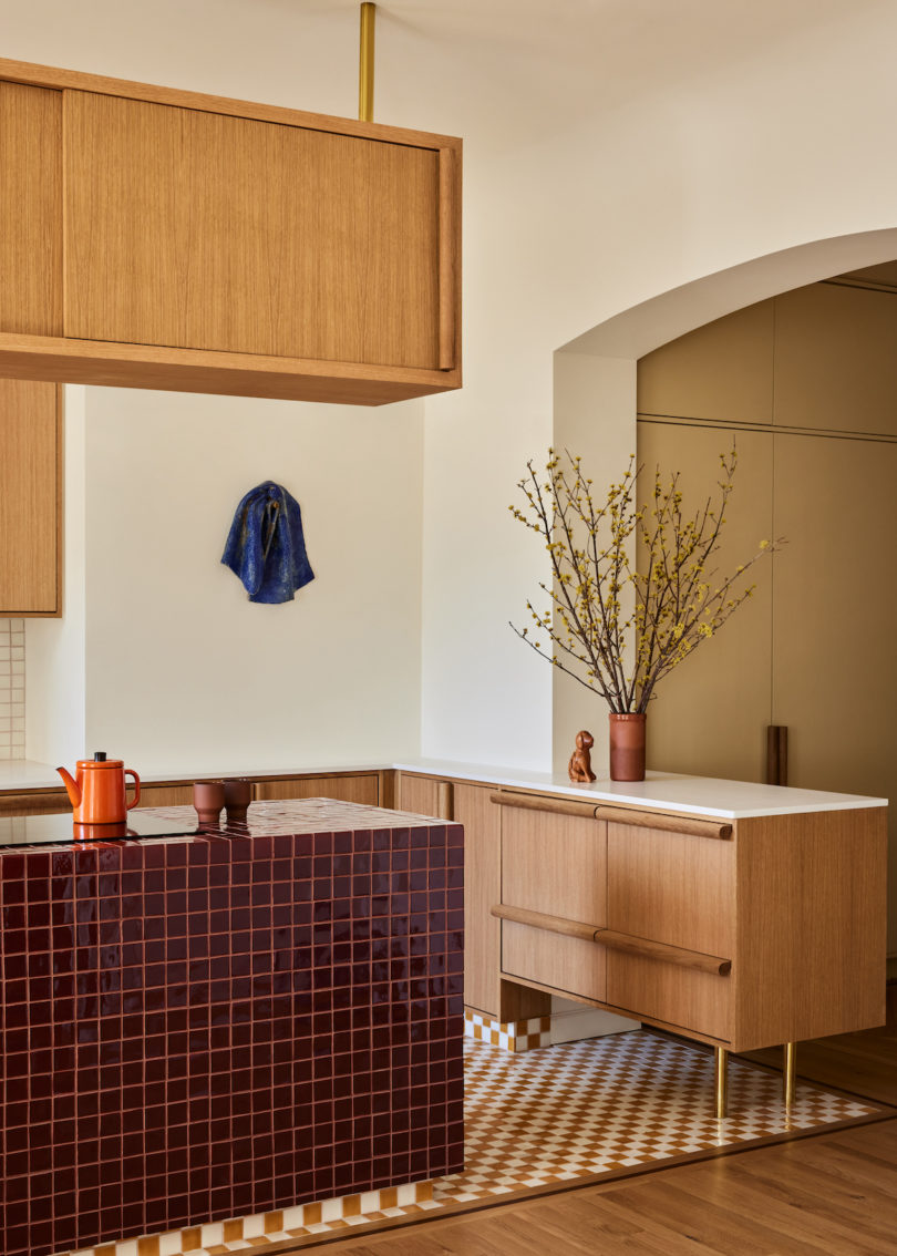 Sculptural island with all-electric appliances in the kitchen