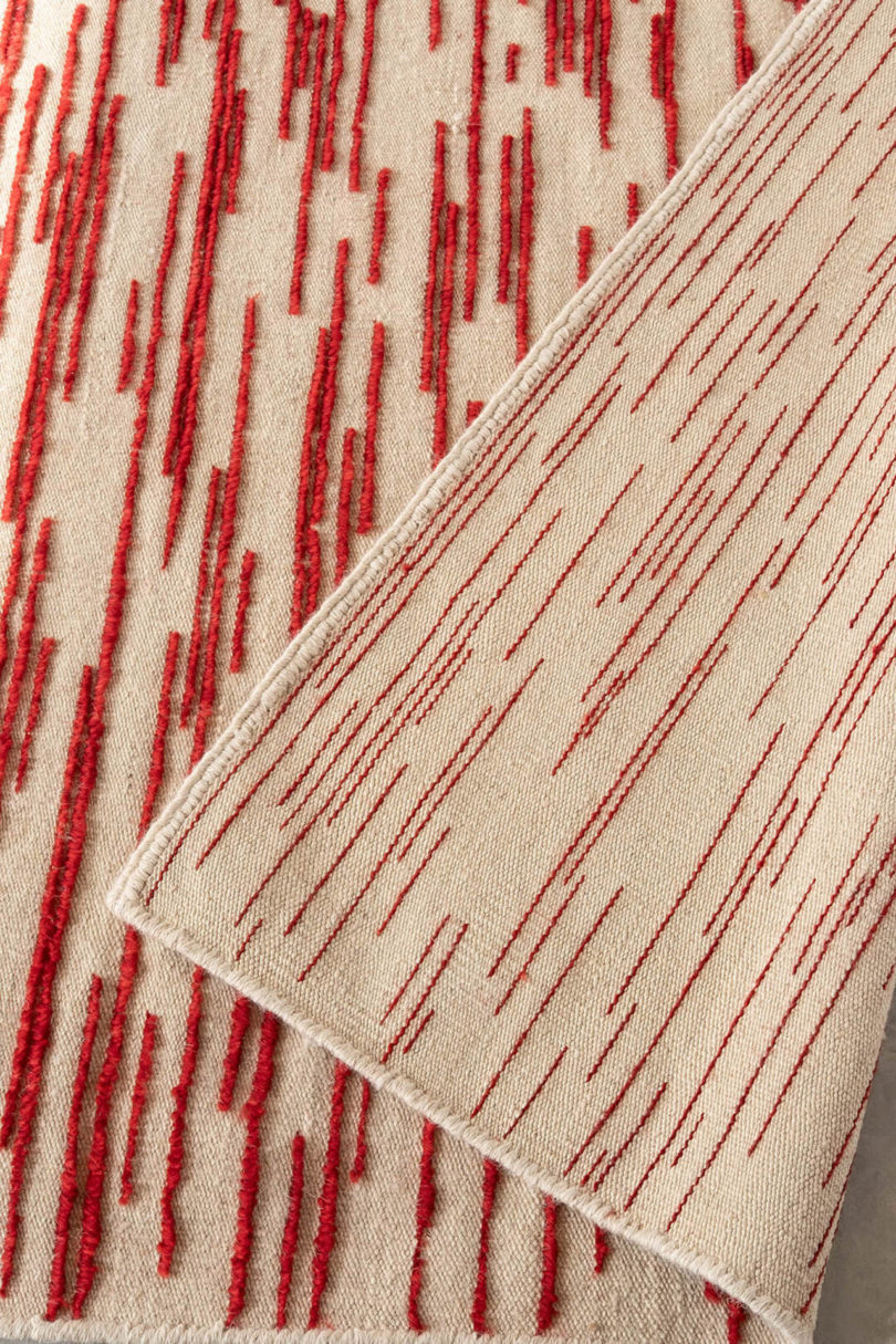 close-up of red and ivory rug