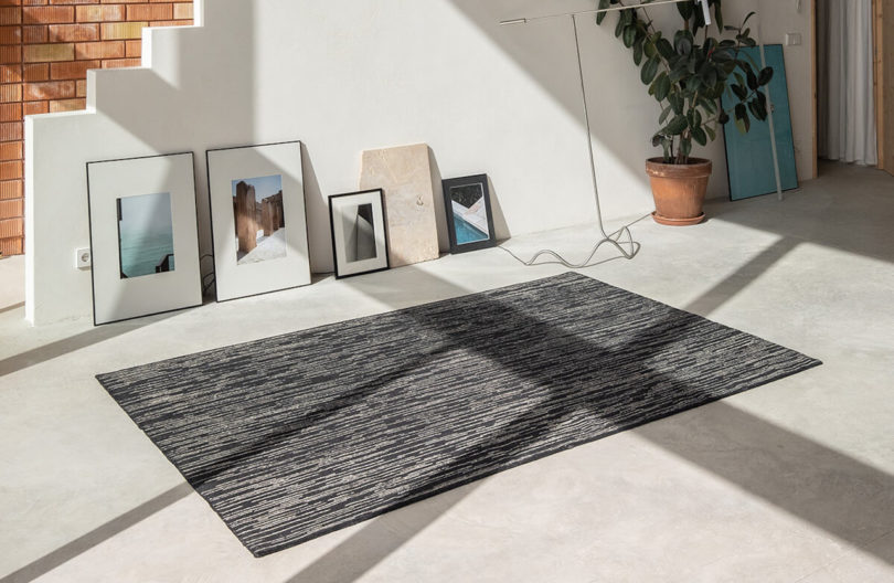 black rugs next to framed art