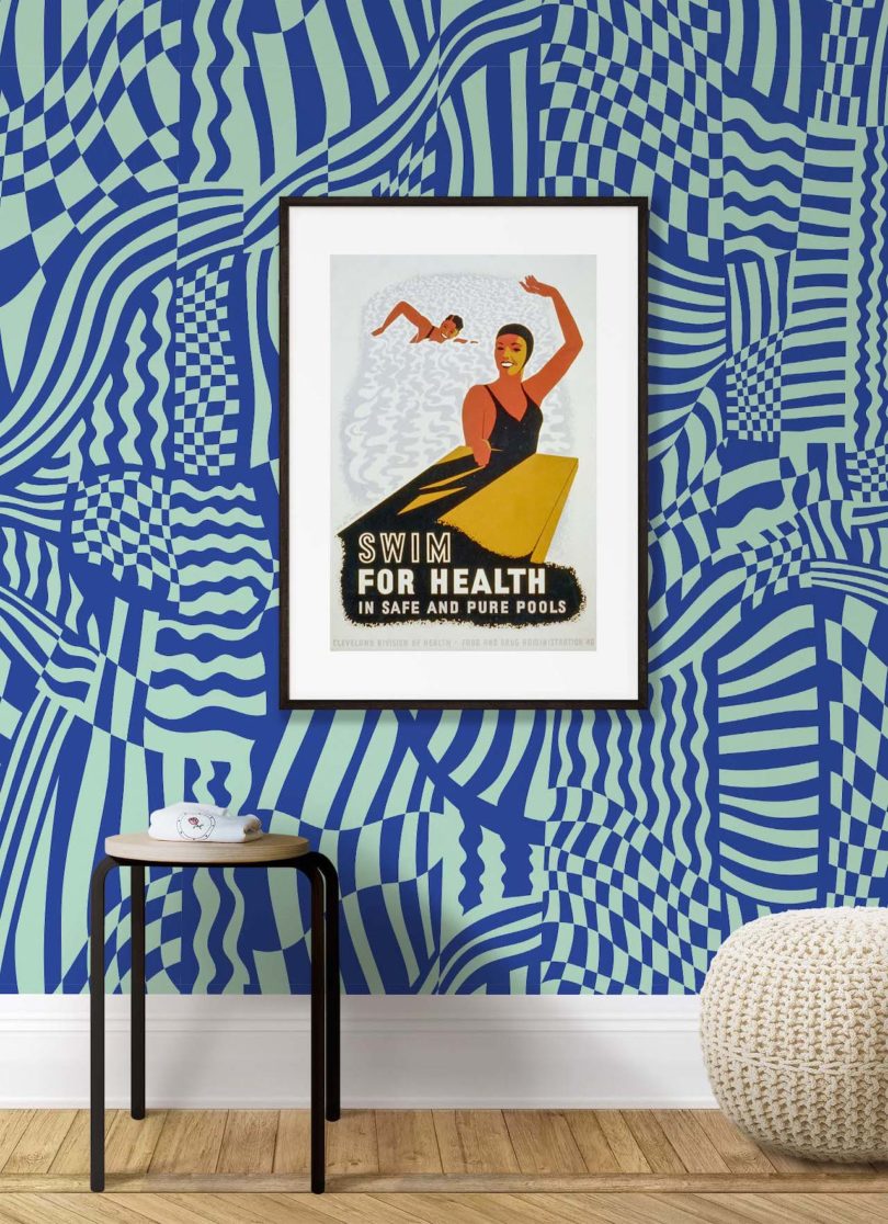 blue wallpaper behind framed art