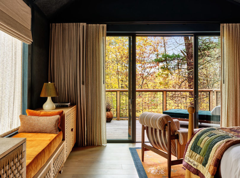 Floor-to-ceiling glass doors opening to spacious outdoor terraces