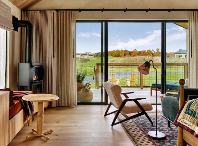 Floor-to-ceiling glass doors opening to spacious outdoor terraces