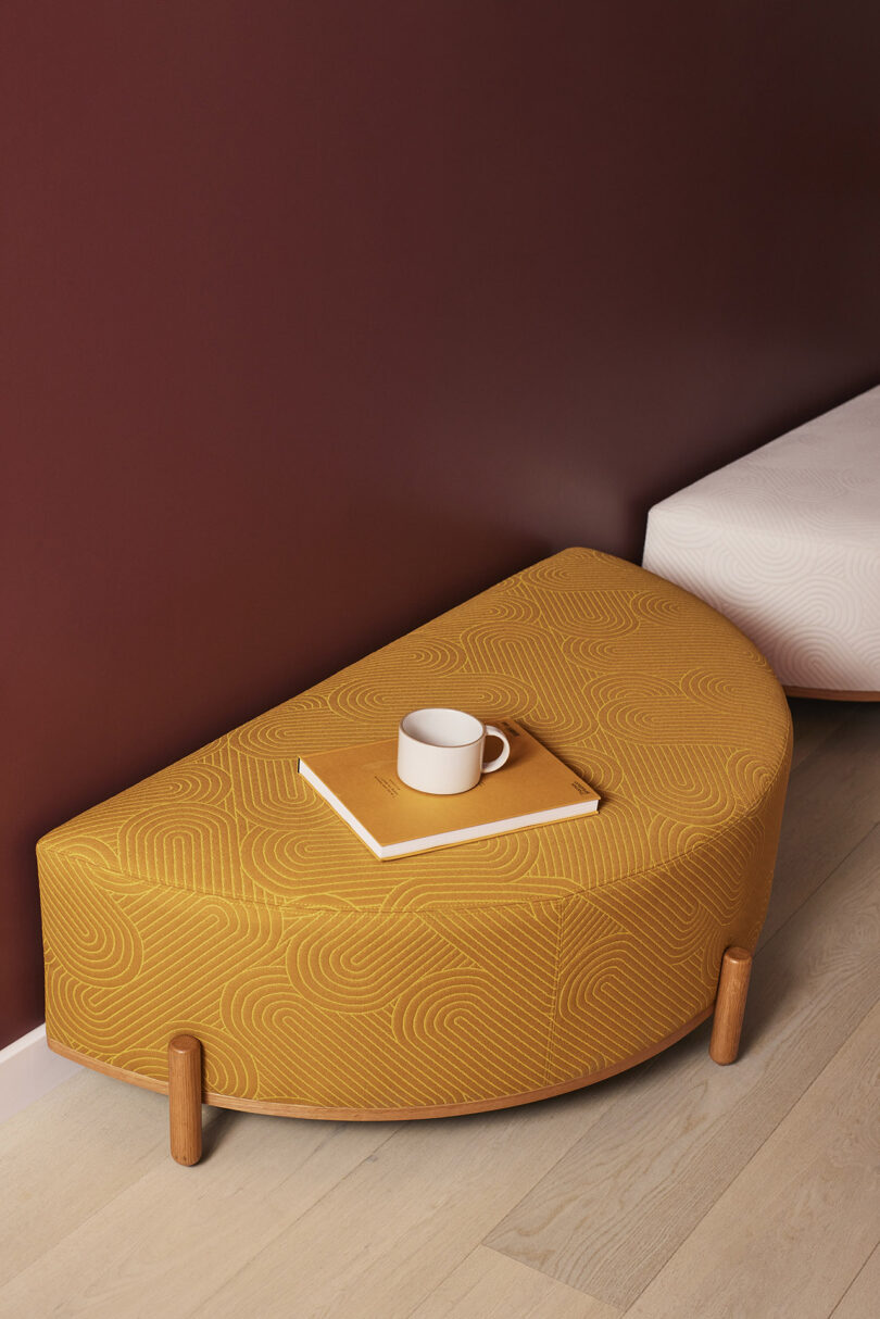 mustard colored half circle pouf stool