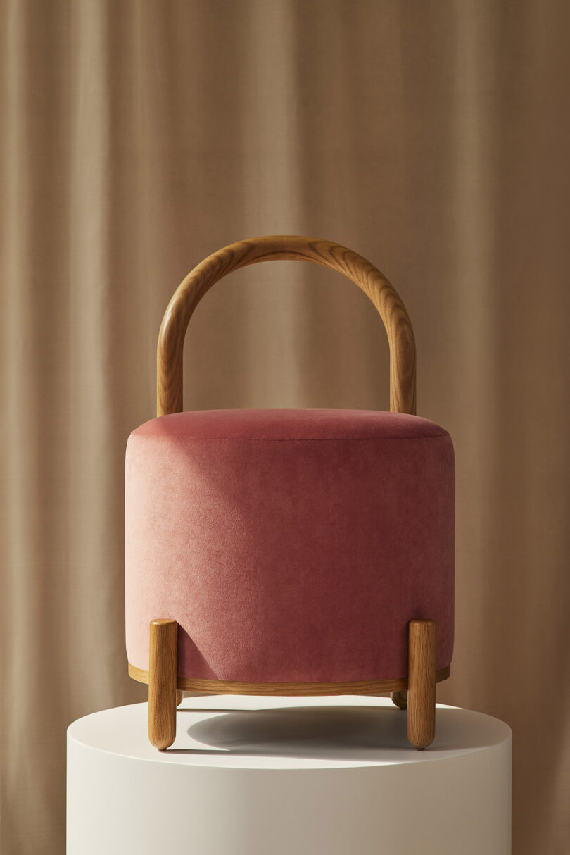 front of dark pink pouf stool