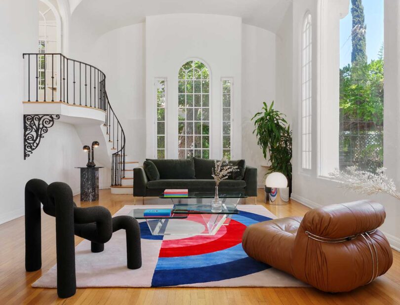 modern white living room with modern furnishings including bold graphic rug