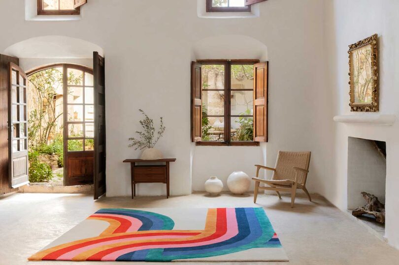 interior shot of modern living room with curvy striped colorful rug