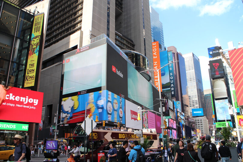 the center of Times Square with lots of skyscraper buildings and crowds