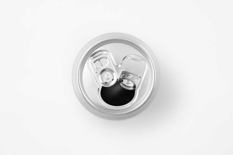 down view of opened chrome beer can with two pull tabs