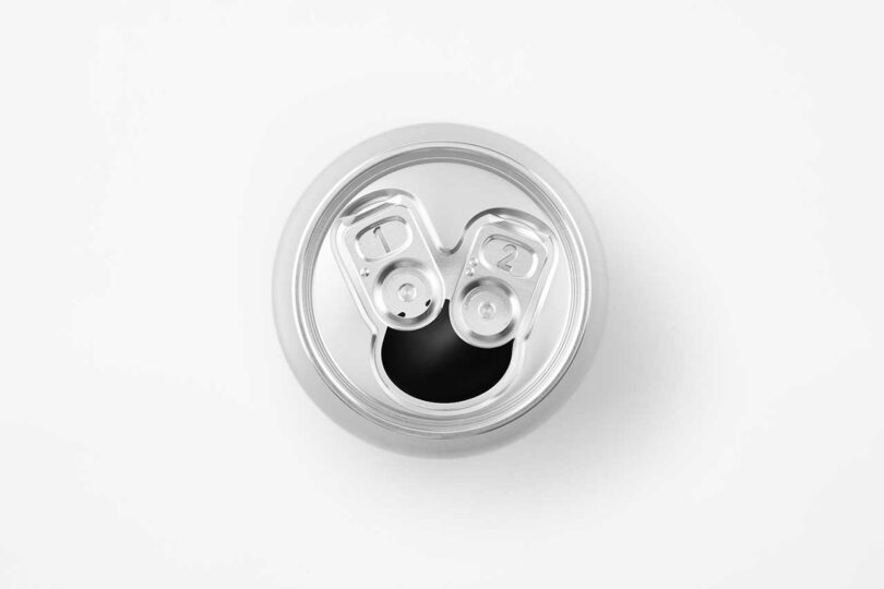 down view of opened chrome beer can with two pull tabs