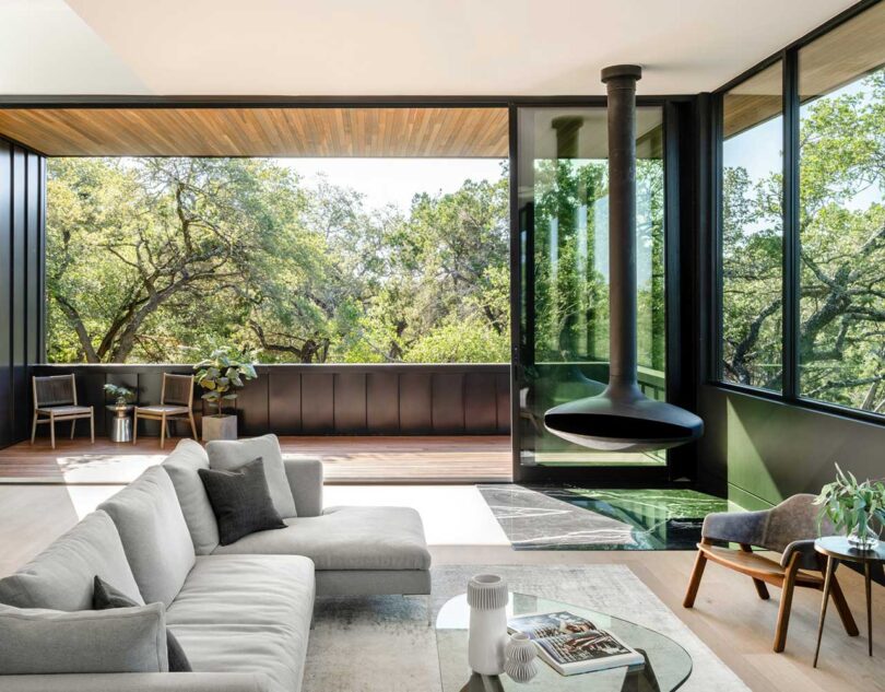 interior view of modern home living room surrounded by windows