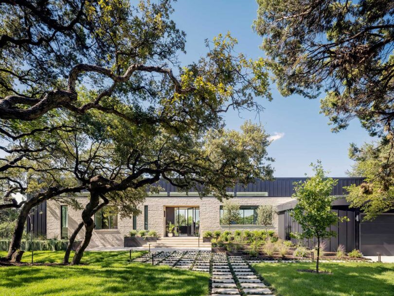 front exterior view of modern home clad in light stone