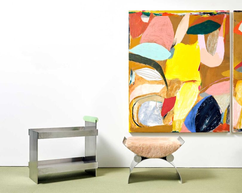 exhibition vignette with colorful abstract art and modern furniture