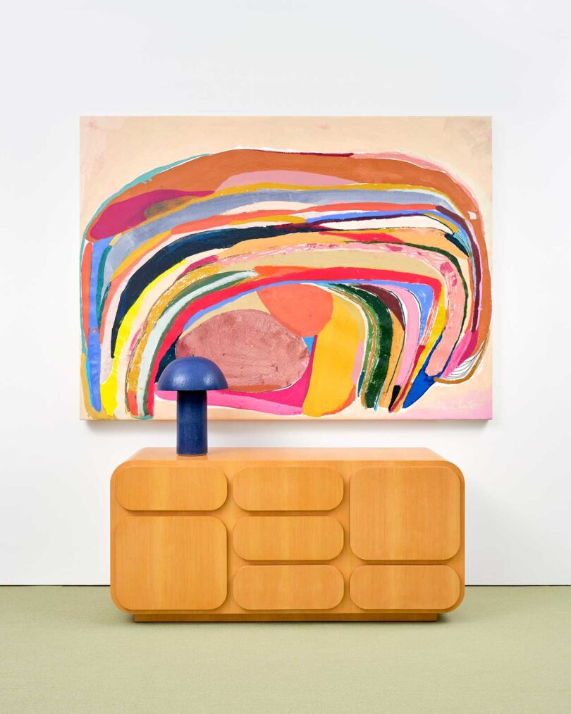 exhibition vignette with colorful abstract art and modern furniture