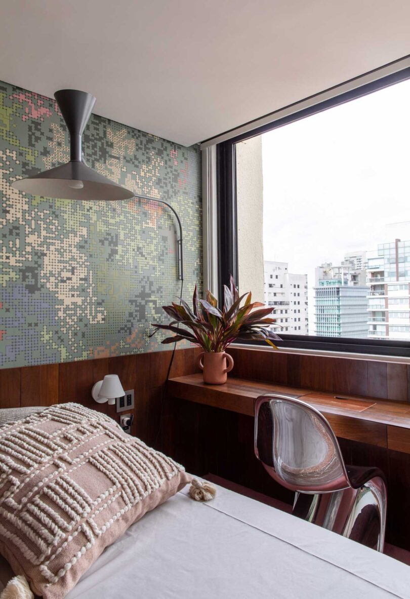 angled view of modern bedroom with mosaic tile wall