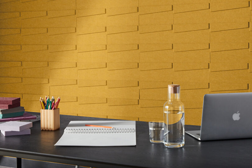 dark yellow acoustic wall tiles in a styled space