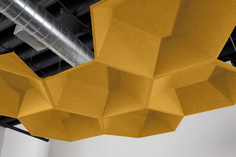 dark yellow polygon-shaped acoustic pendants