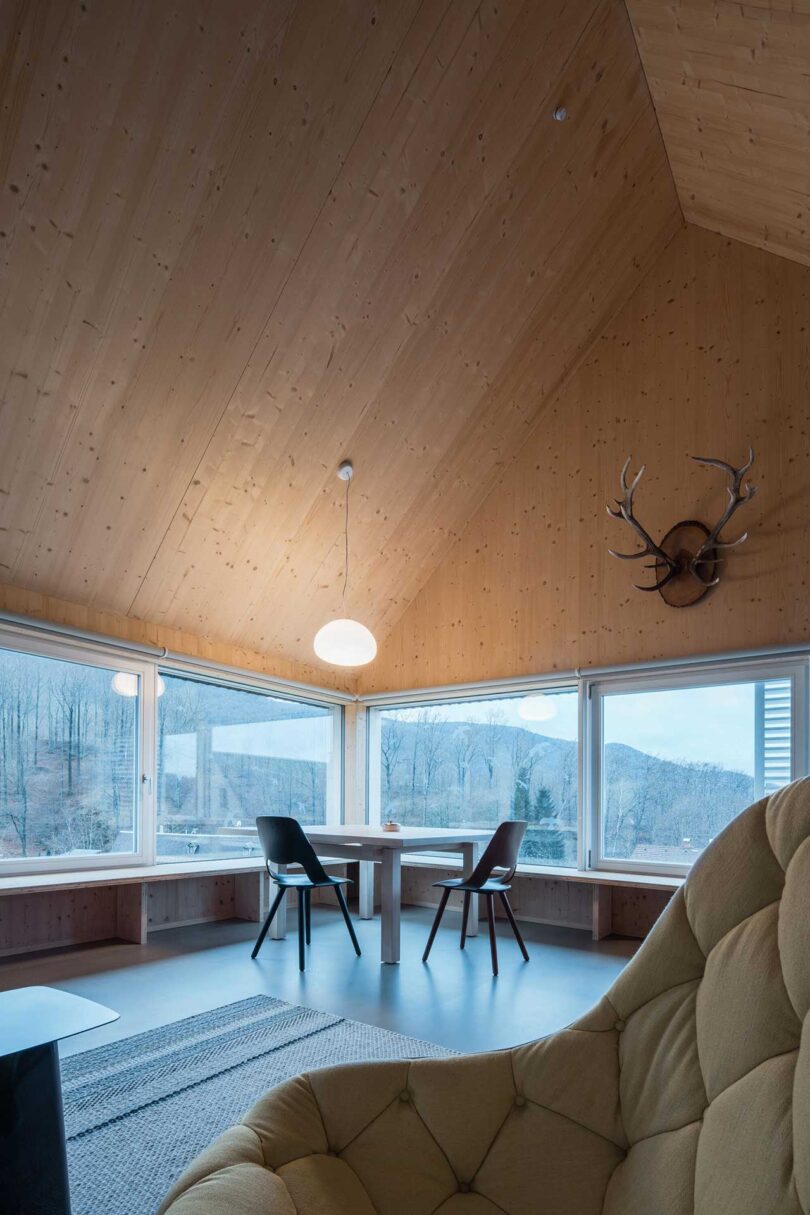 corner interior view of modern living space with pitched roof