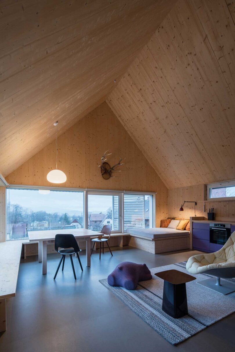 corner interior view of modern living space with pitched roof