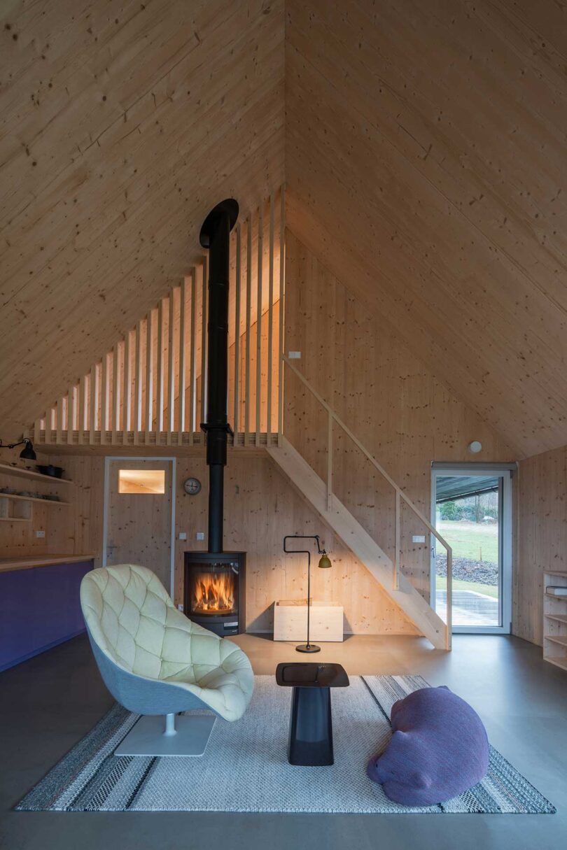 interior view of modern living space with pitched roof and staircase