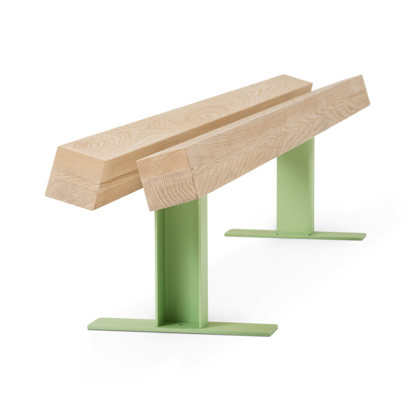 light wood bench with light green metal legs