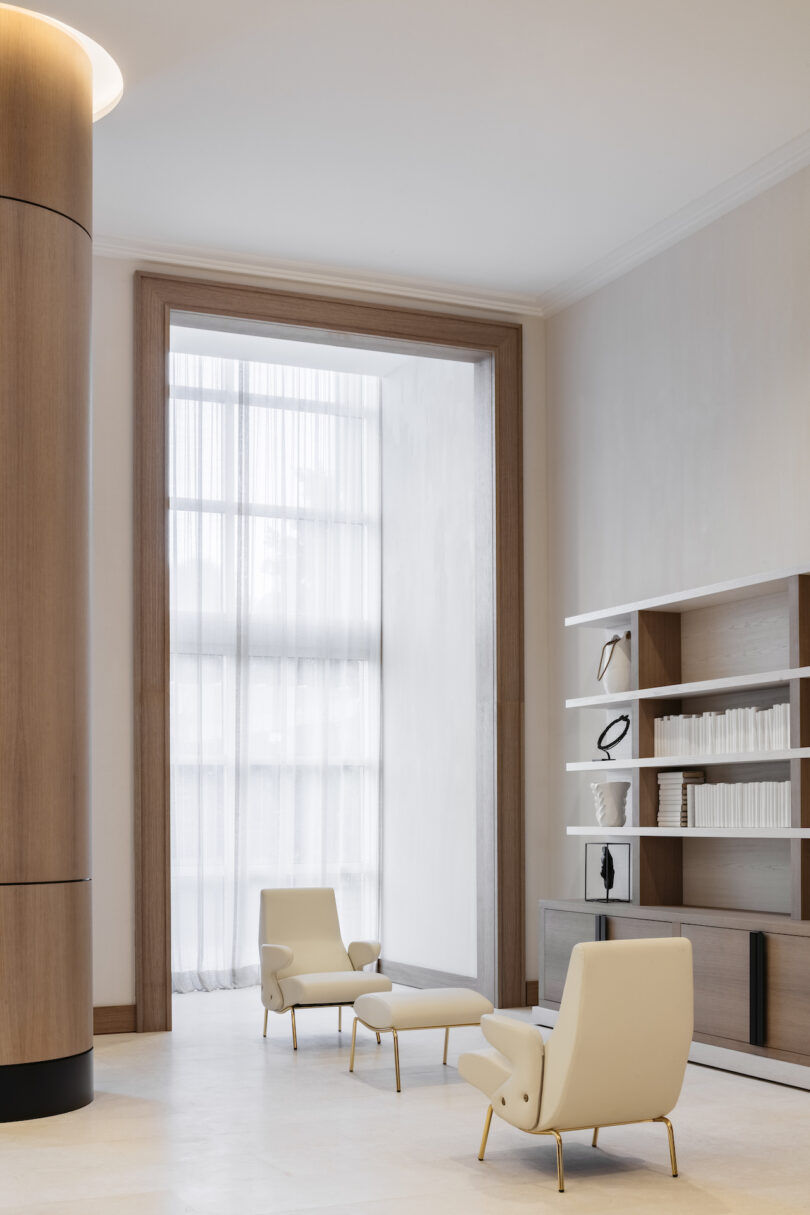 Bright and airy living room with neutral-toned furnishings, accentuated by soft, natural jute rugs and linen curtains