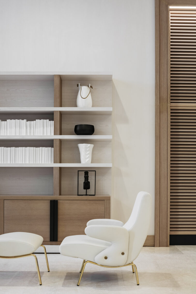 A strategic incorporation of blackened steel details, offering a bold contrast against the neutral palette of the kitchen's cabinetry