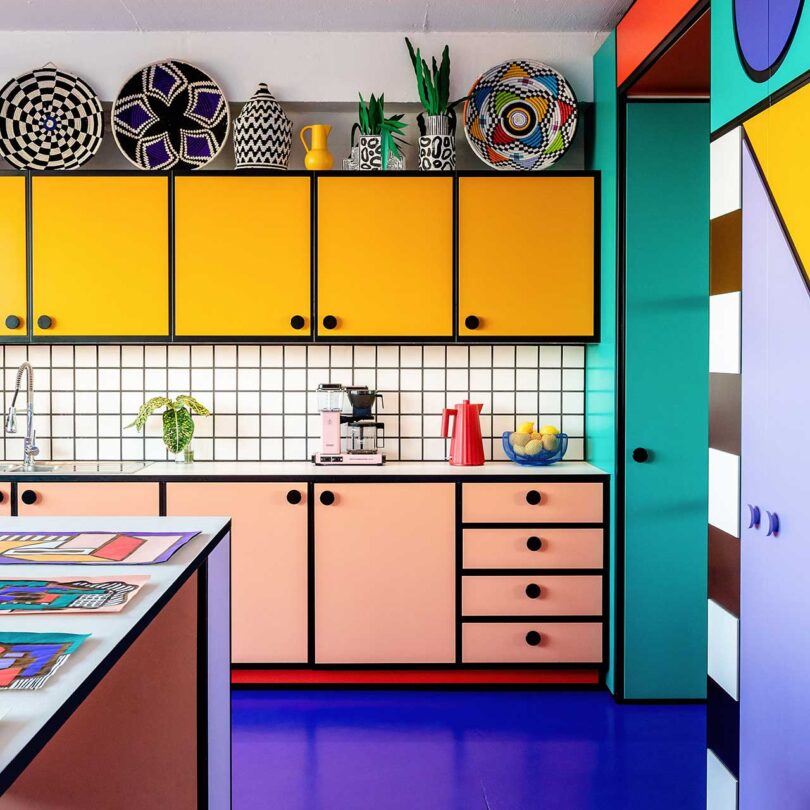 interior view of modern office with bold geometric kitchen