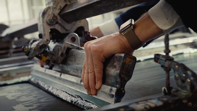 a person creating a screen print