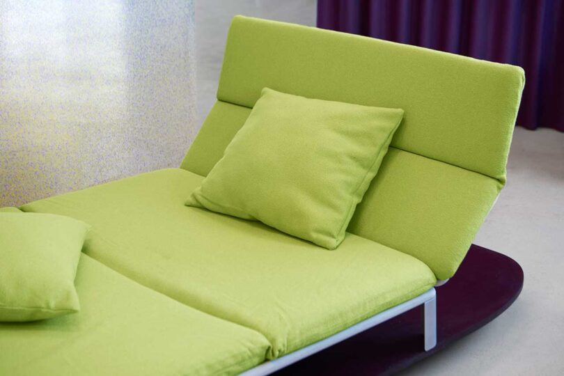 side angled view of modular lightweight green couch