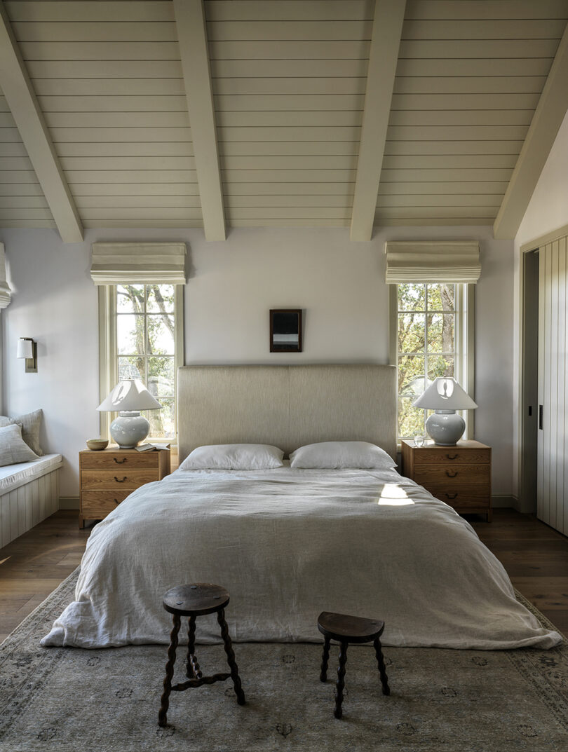 bedroom under eaves with bed and nightststands