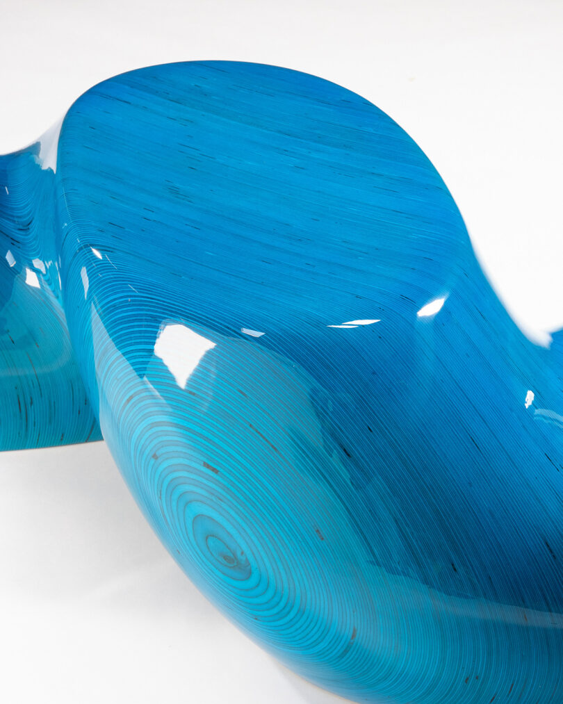 detail of glossy cyan blue twisted stacked plywood table