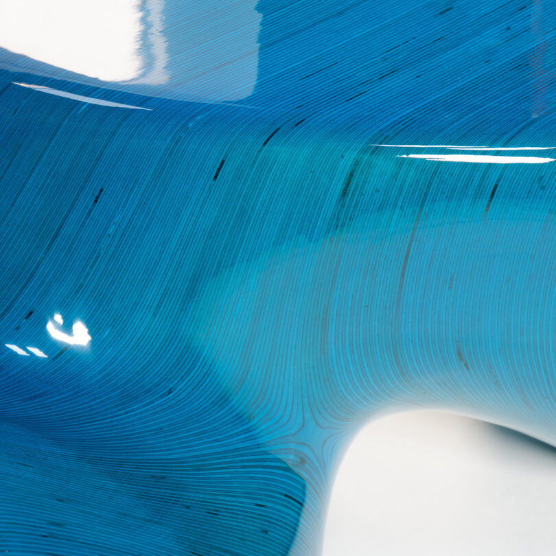 detail of glossy cyan blue twisted stacked plywood table