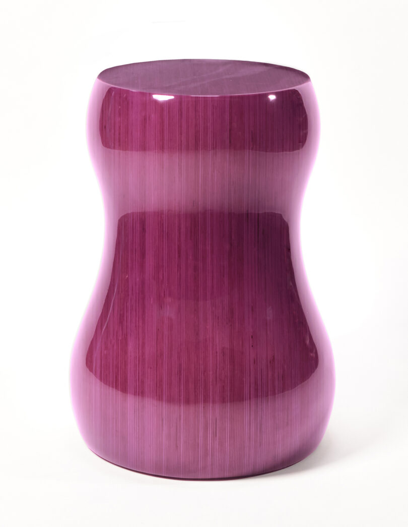 glossy purple curvaceous stacked plywood table