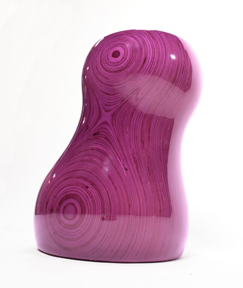 glossy purple curvaceous stacked plywood table