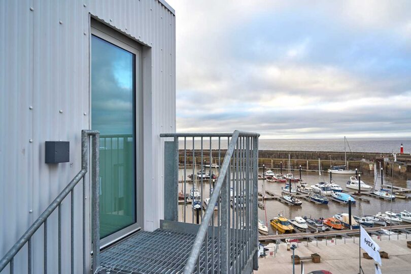 angled view of door exterior of elevated living pod