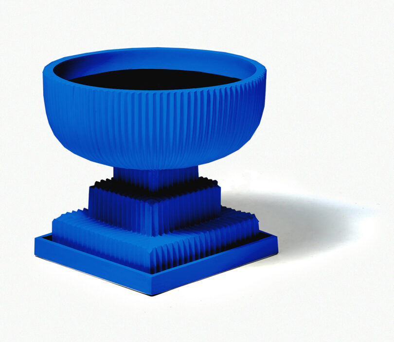 modern cobalt blue fluted urn on white background